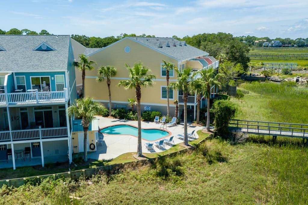 Side view with pool and marsh